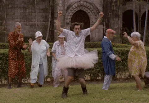 gif of man dancing in tutu with old people dancing behind him