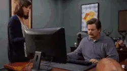 gif of office worker throwing his computer in dumpster