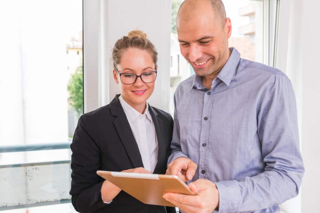 two managers looking at report