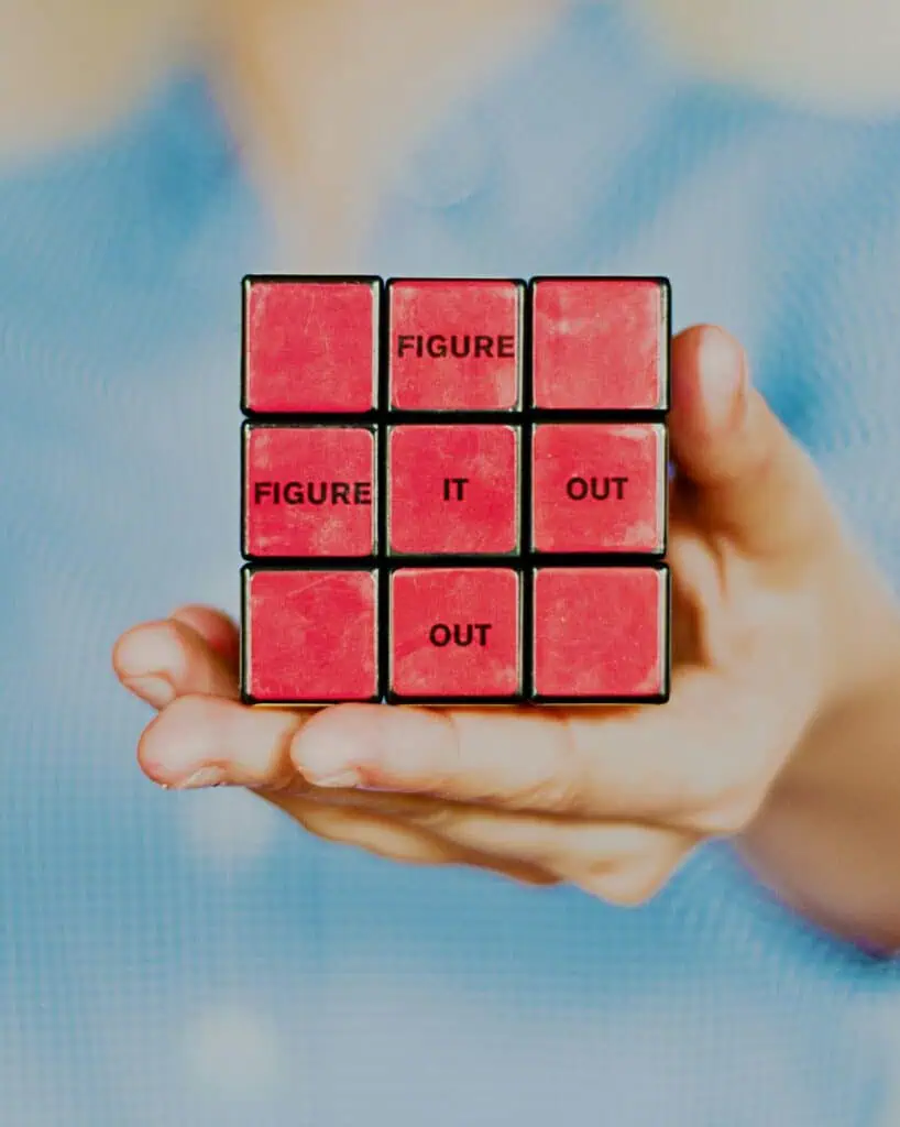 Figure it out written on red rubix cube