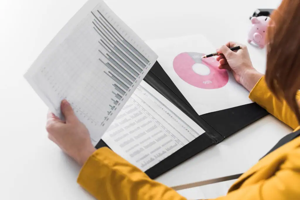 Woman studying report graphs