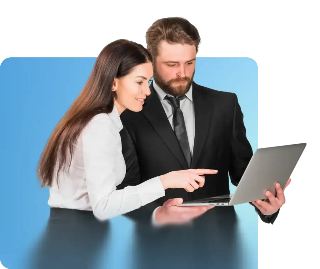 Expert professionals collaborating on employment solutions using a laptop, representing GQ Interim recruitment services.