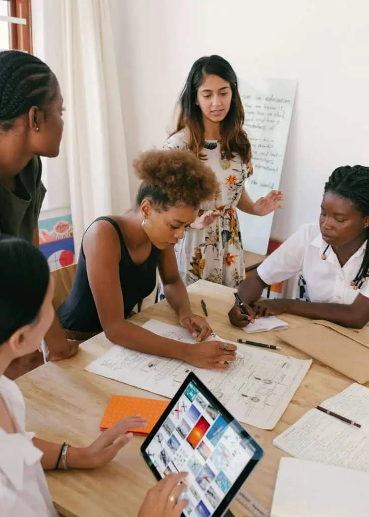 Team of business optimization professionals discuses