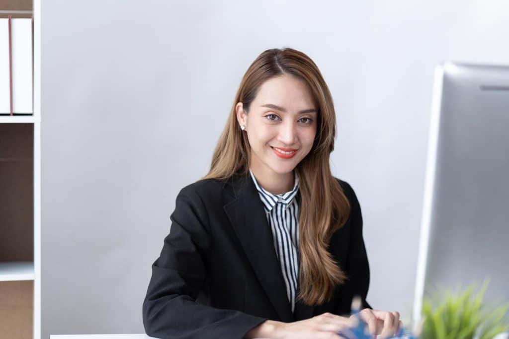 Interim marketing specialist sitting at her desk working
